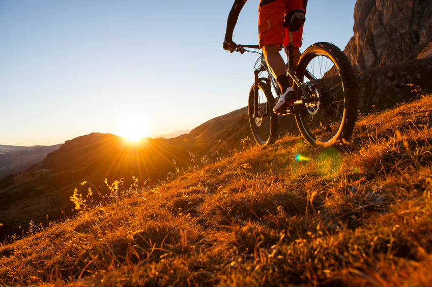 Extreme mountainbike sport athlete riding outdoors trail